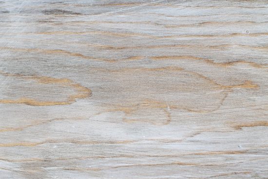 close up of weathered wood finish that has has a gray wash wood look