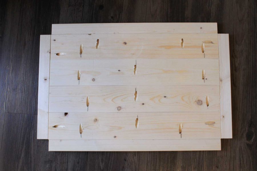 Assembling the bottom wood shelf of the bar cart