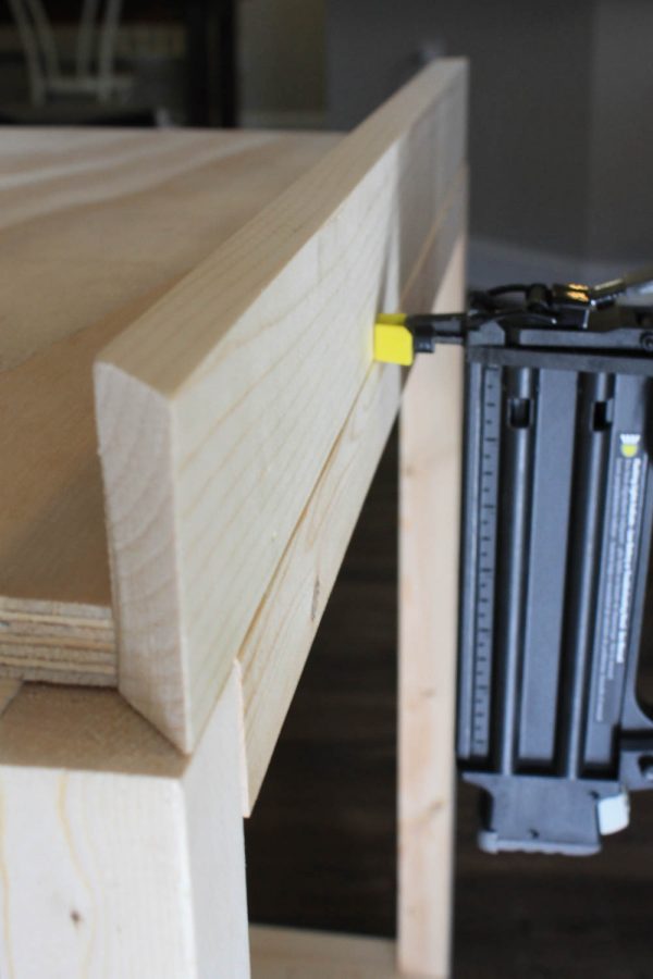 Attaching corners of bar cart with brad nails