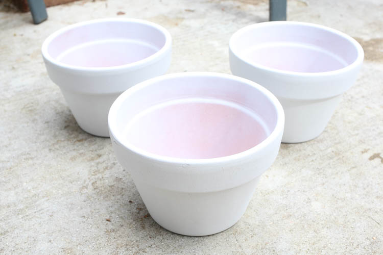 terra cotta flower pots spray painted white