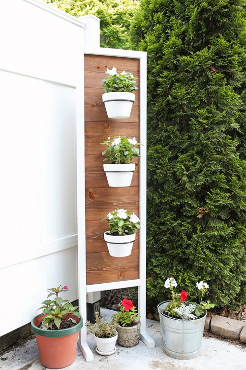 DIY Plant stand with flowers on back patio