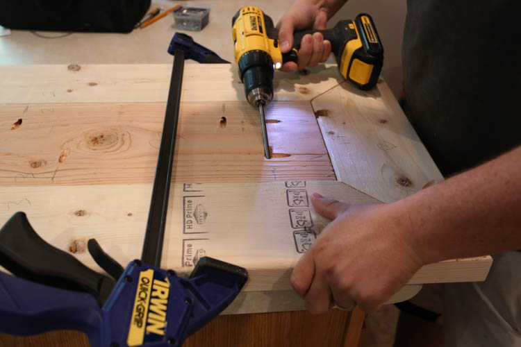 attaching the TV stand top boards together with Kreg screws and drill