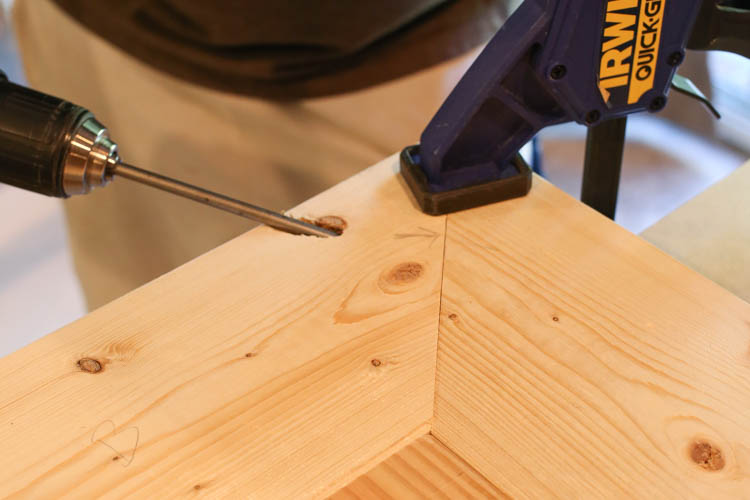 attaching the TV stand top boards together with Kreg screws and drill and clamp