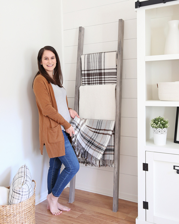 holding blanket on blanket ladder diy in living room