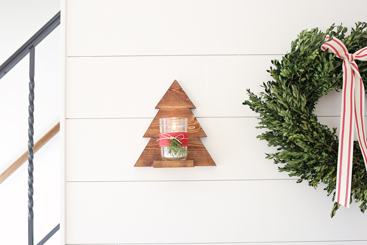 DIY Wood Christmas Tree Mason Jar Sconce hanging on shiplap wall