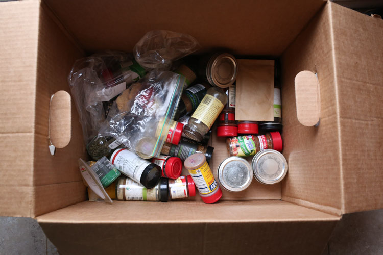 Disorganized Spice Jars in box