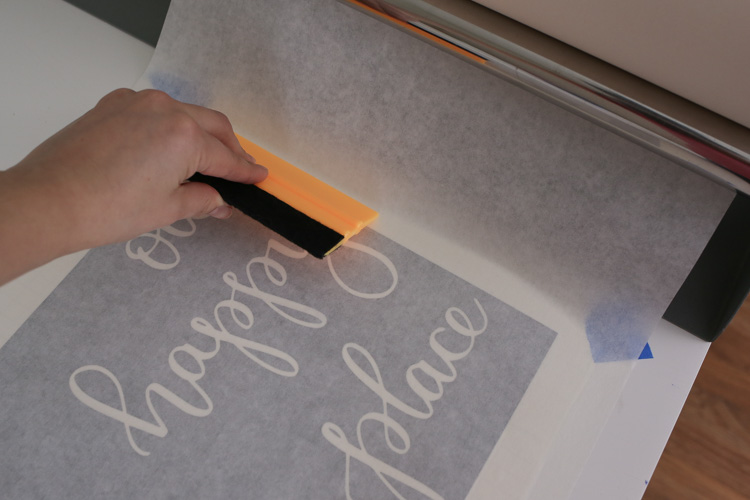 Apply transfer tape to vinyl stencil using tape roller and Squeegee