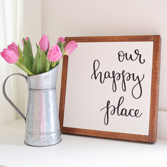 Our Happy Place DIY Wood Sign with pink tulips in galvanized pitcher