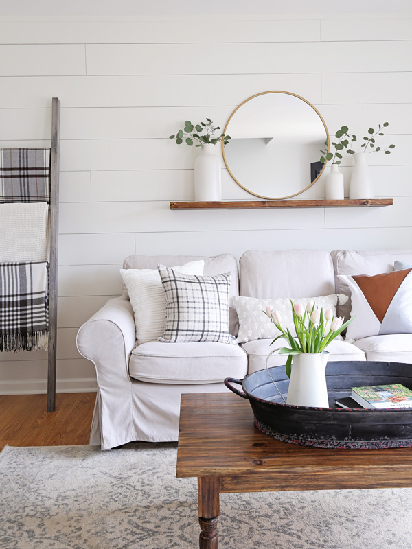 Living Room Makeover with white painted shiplap wall