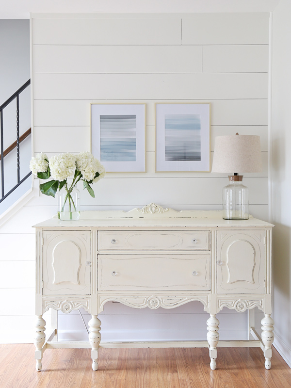 White vintage buffet with two color distressing with chalk paint