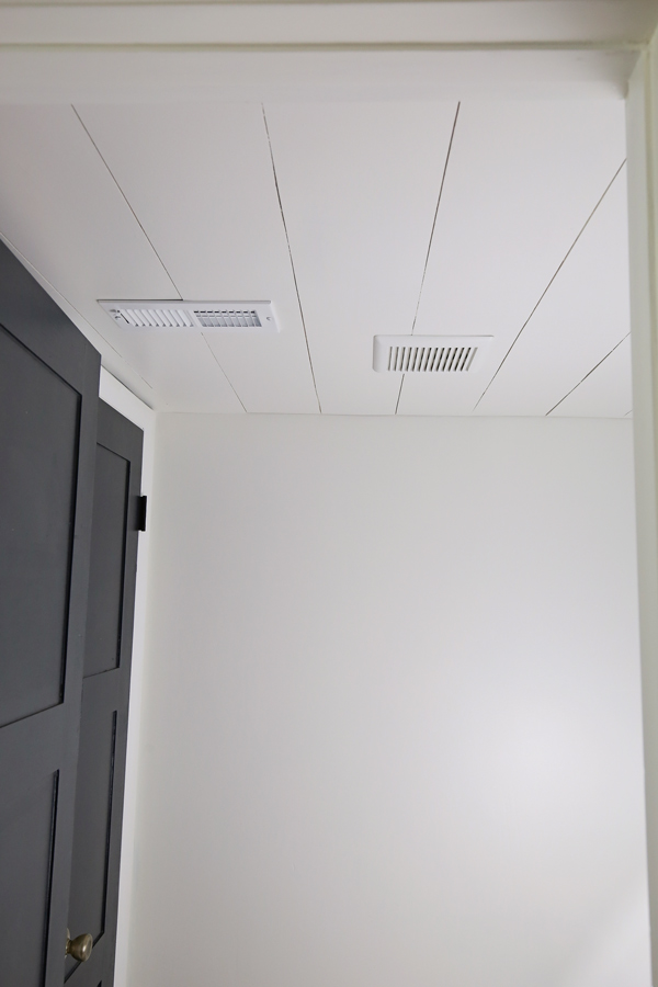 White painted shiplap ceiling DIY on a bathroom ceiling