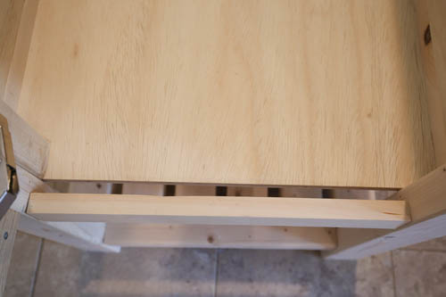 cover gap with scrap wood on vanity base