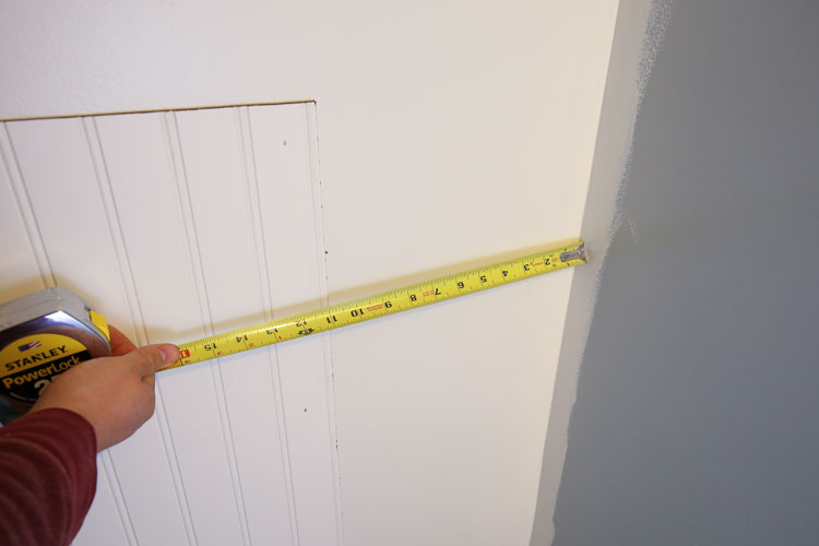 measuring the width from the edge of the last beadboard panel to the wall corner