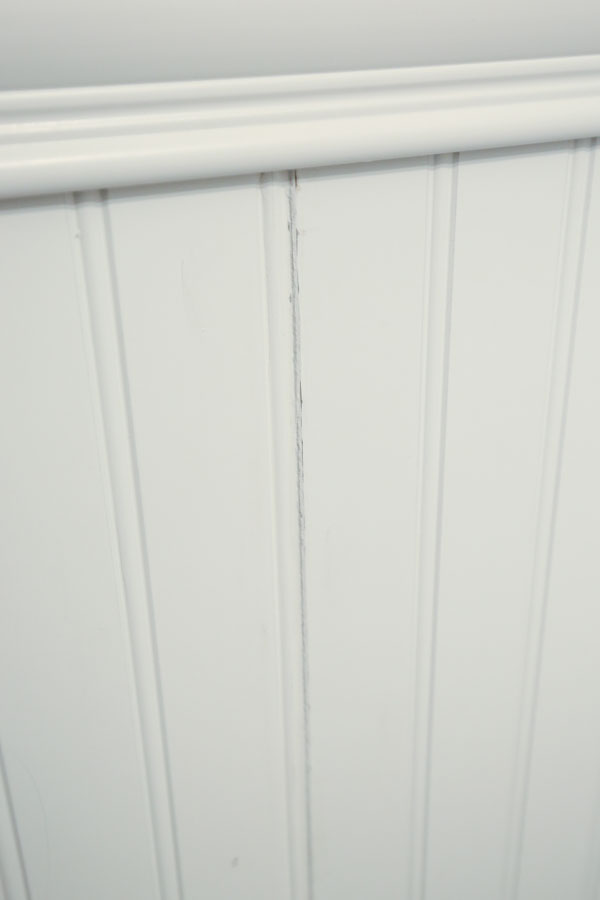 two beadboard panels connected with a caulked crack