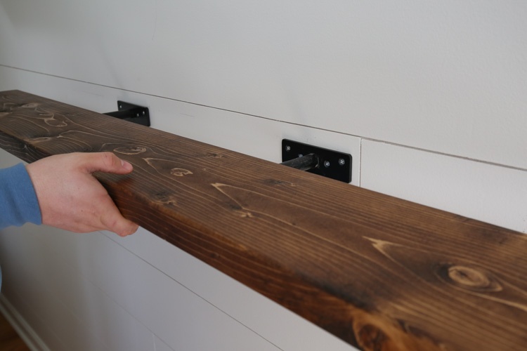 Instaling easy DIY floating shelf on wall brackets