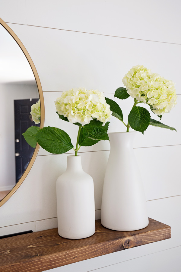 Easy DIY floating shelf with hydrangeas in two vases