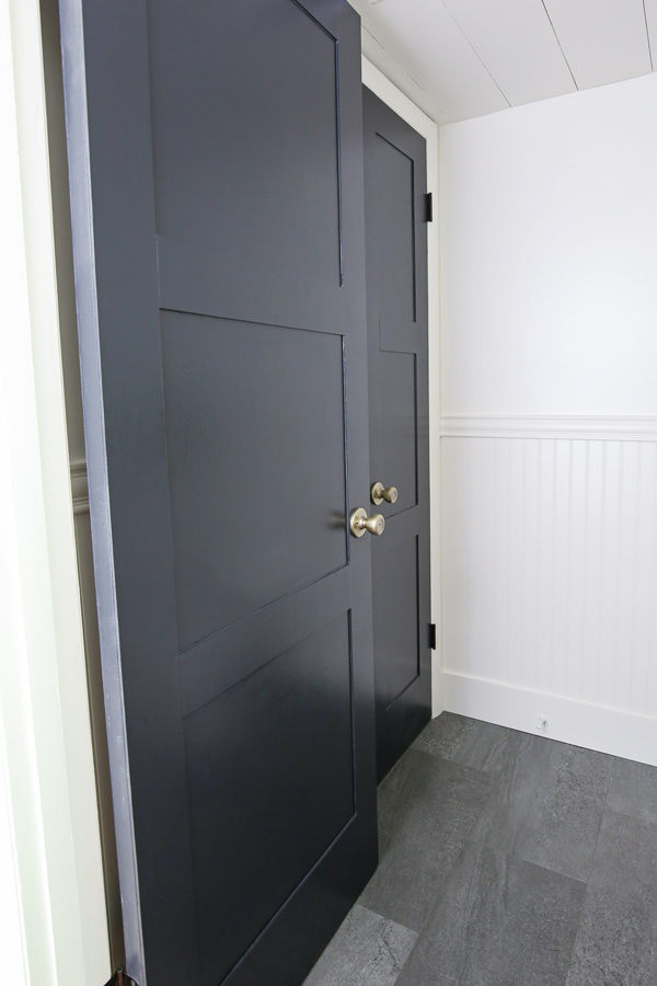 Updated black panel doors in a bathroom makeover