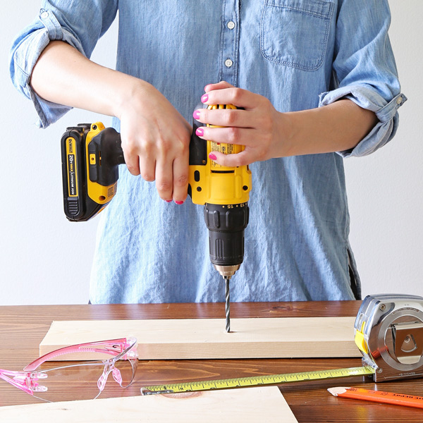 woman using a power drill