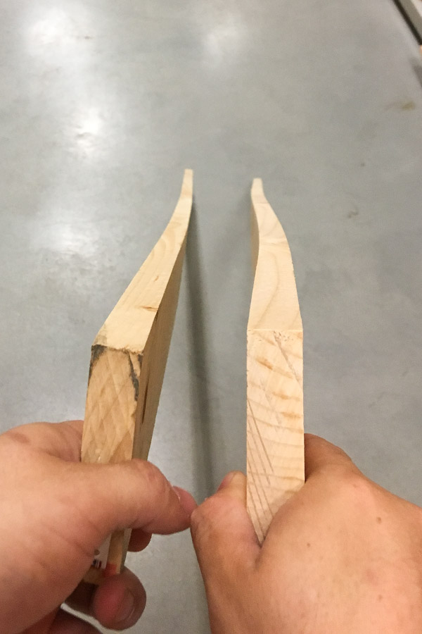 Two wood boards that are warped and bowing