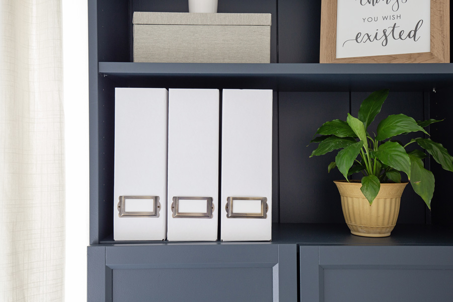 DIY magazine holders on a bookshelf