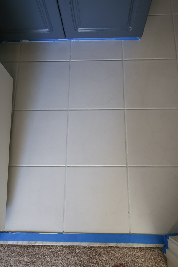 Bathroom tile floor covered with primer