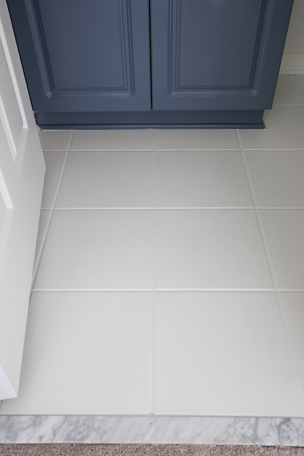 white painted floor tiles in bathroom