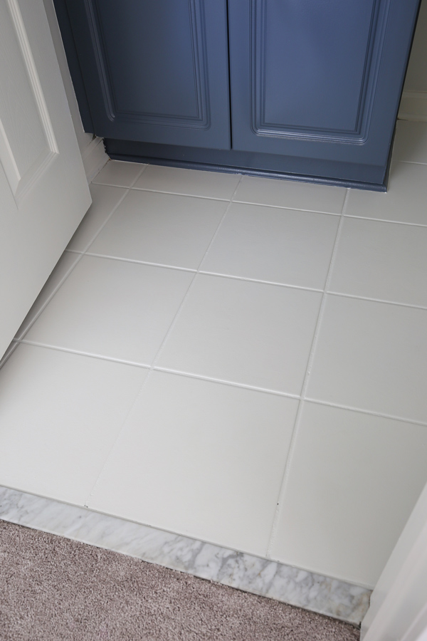 ceramic floor tile painted white in a bathroom