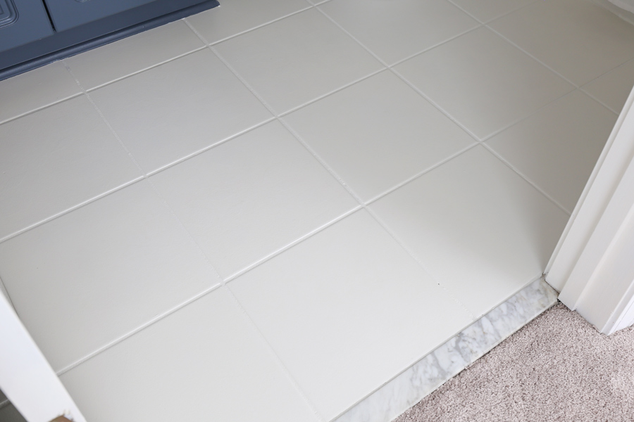 ceramic floor tile painted white in a bathroom