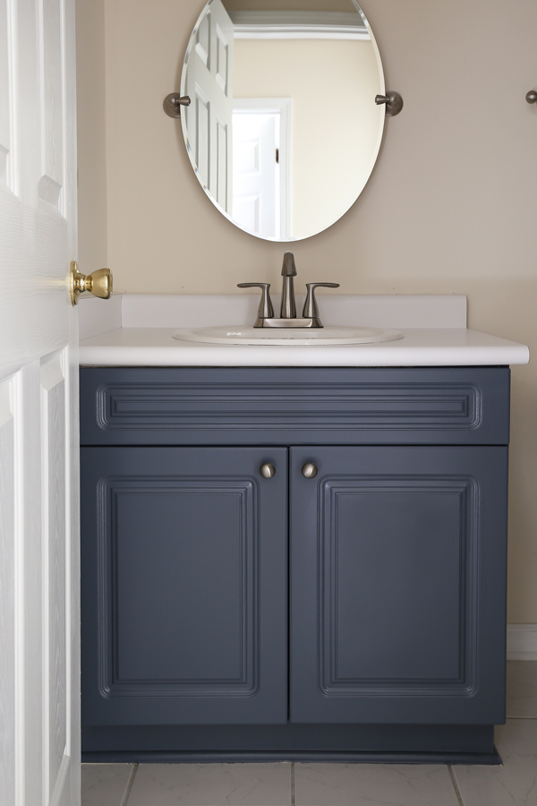 A painted bathroom vanity in blue grey paint