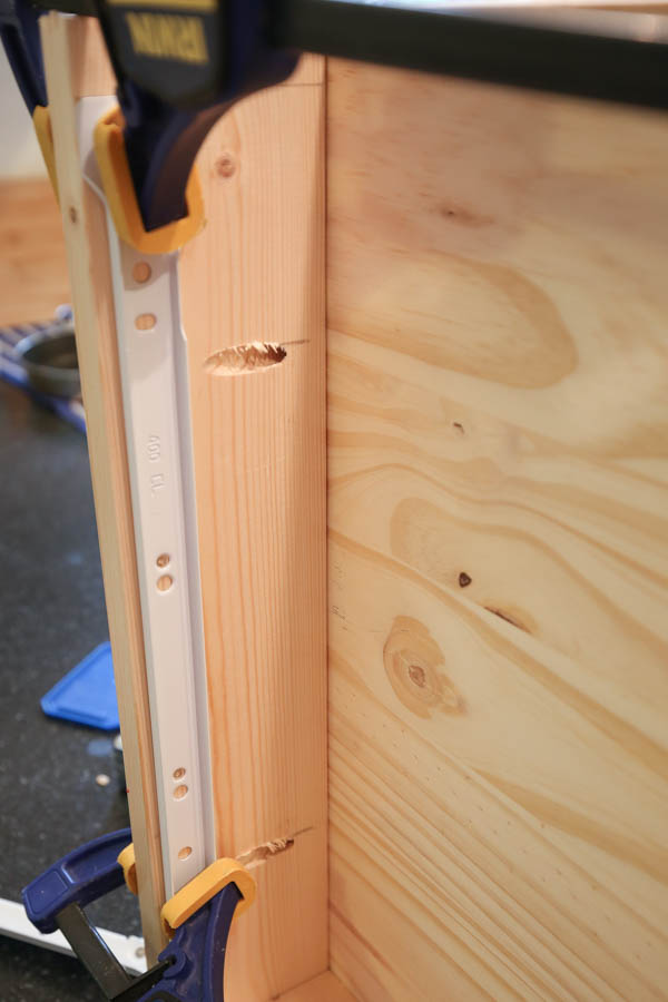 Attaching drawer slide on interior of makeup vanity