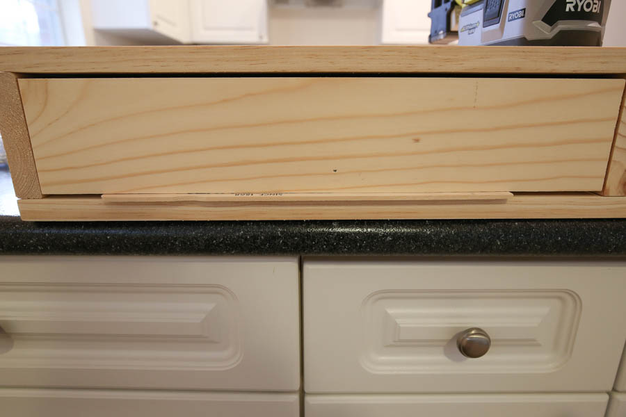 Attaching the drawer faces to the makeup vanity