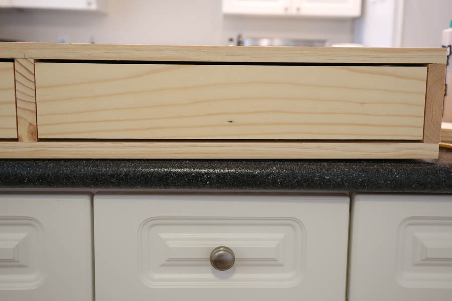 Drawer faces attached to the DIY makeup vanity