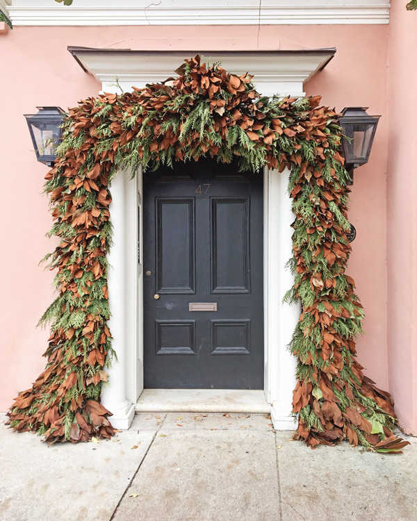 Magnolia and fresh pine garland over front door in Charleston for Christmas decor