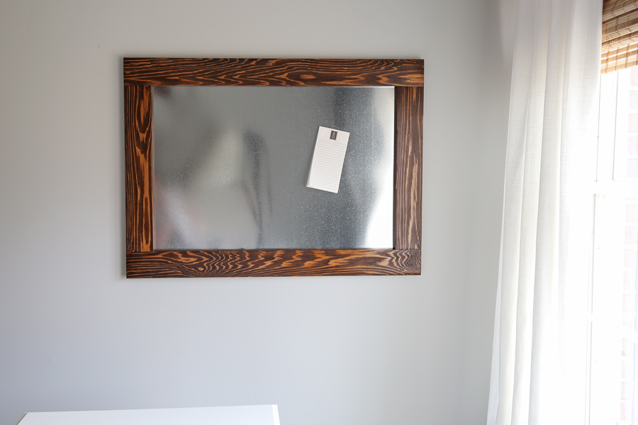 Wood framed DIY magnetic board in office