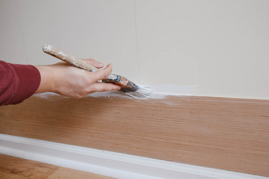 how to paint shiplap cracks - Painting shiplap board gaps during installation with a paint brush