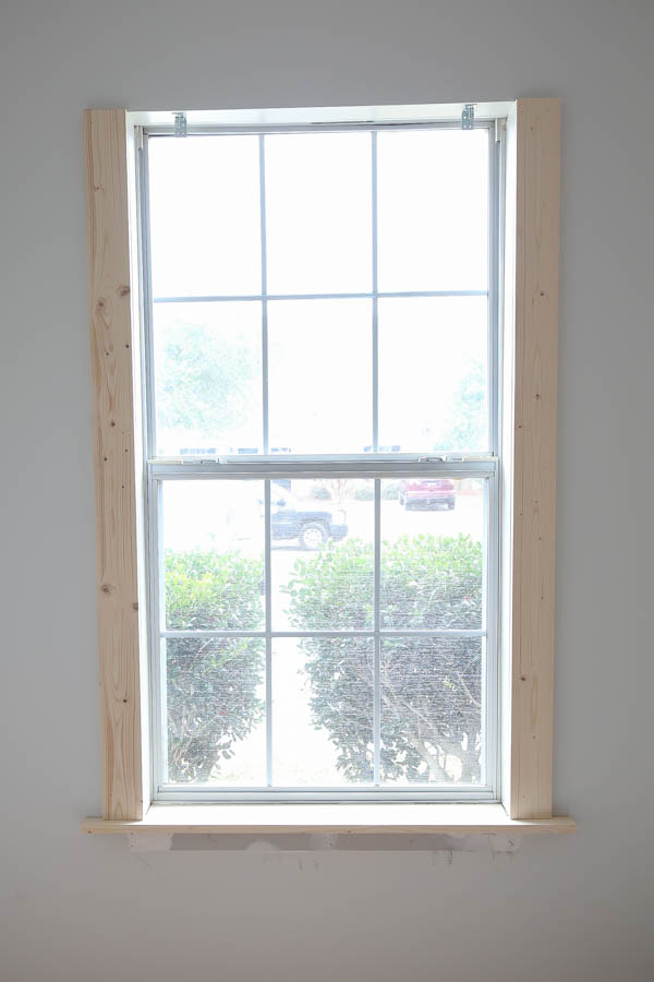 Add the 1x4 DIY window trim to the window sides 