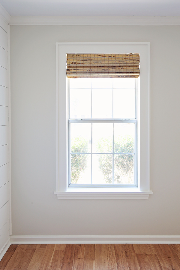 DIY window trim and bamboo blinds on window