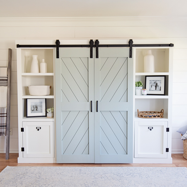 living room with white shiplap wall and double barn doors with shiplap painted oyster bay sherwin williams