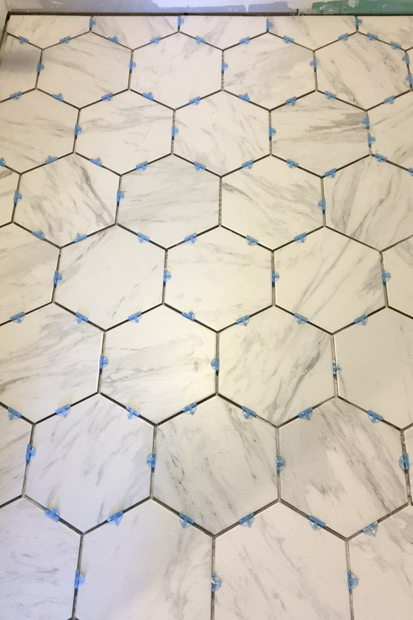 installing marble look porcelain hexagon tile