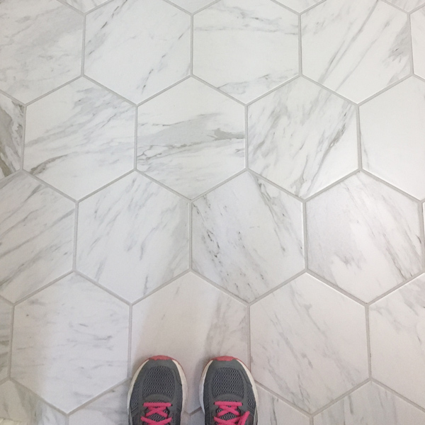 Hexagon Porcelain tile that looks like marble on a bathroom floor