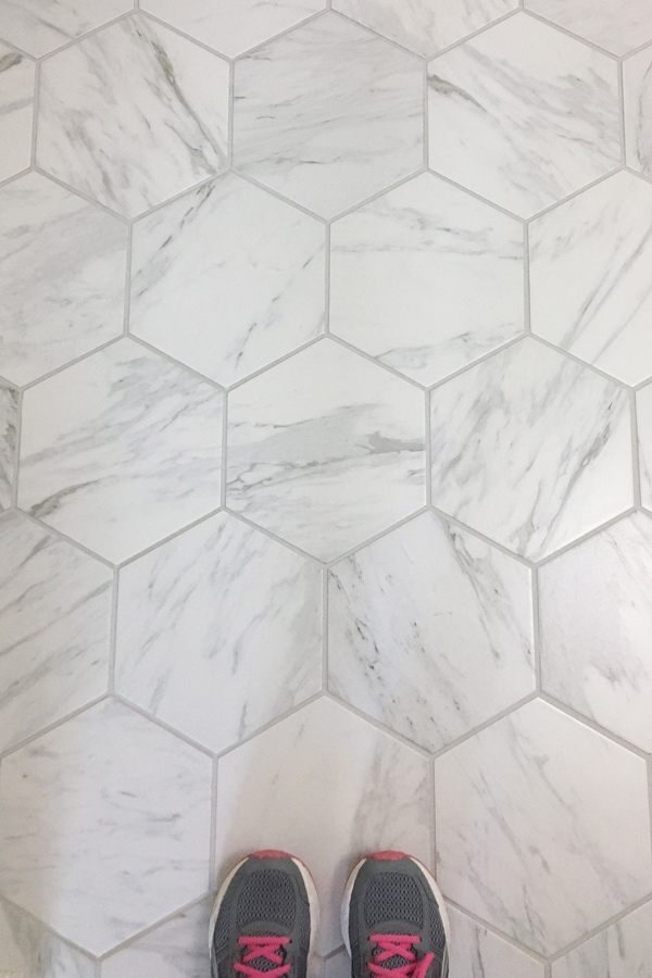 Hexagon Porcelain tile that looks like marble on a bathroom floor