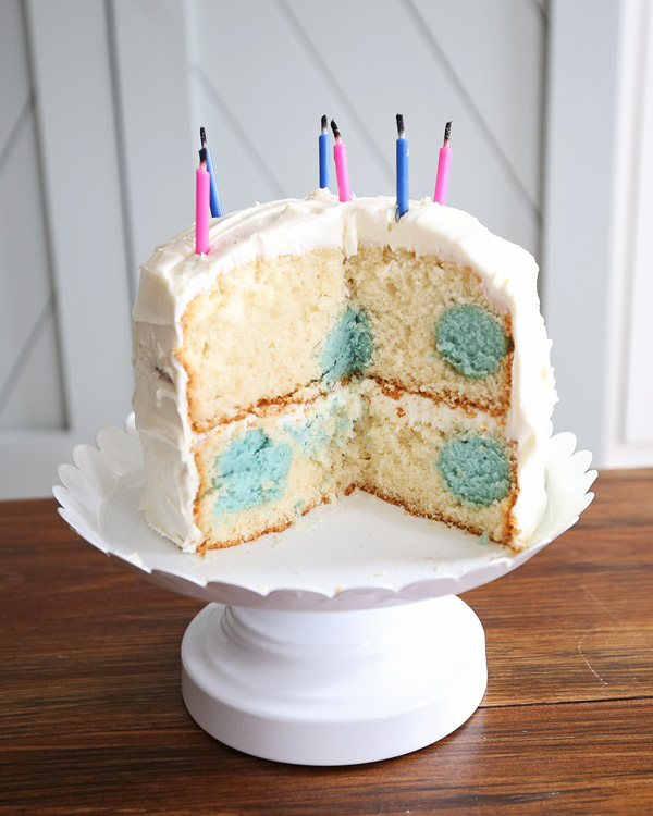 gender reveal polka dot cake with blue polka dots