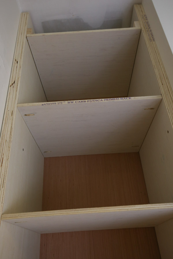 Attach the remaining shelves for the DIY built in with pocket holes and Kreg screws