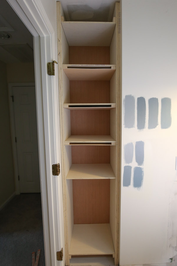 Attach 1/4" plywood to 1x2 wood braces on shelves to create the bottom of the shelf
