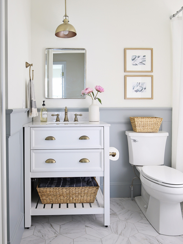 budget bathroom makeover with porcelain tile that looks like marble