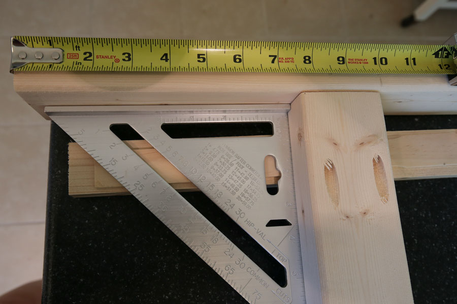 Attach longer boards to shorter boards to start making side couch frames