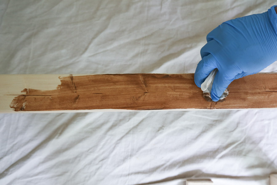 applying stain to wood with a rag