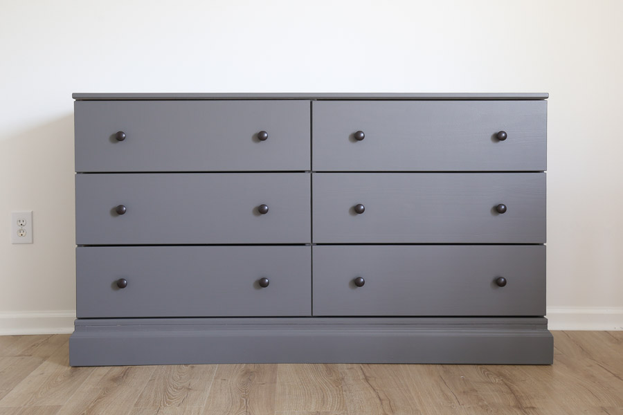 ikea tarva dresser hack with new knobs, baseboard molding, and painted charcoal gray