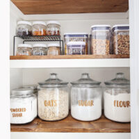 how to make vinyl labels with cricut with pantry labels on jars on pantry shelf