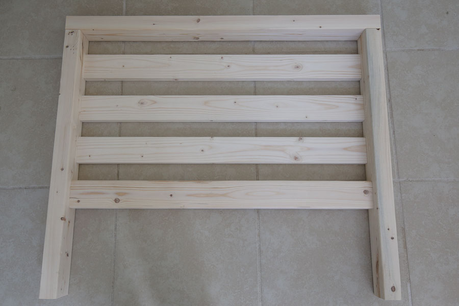 Add side slat boards to DIY outdoor chair side frames